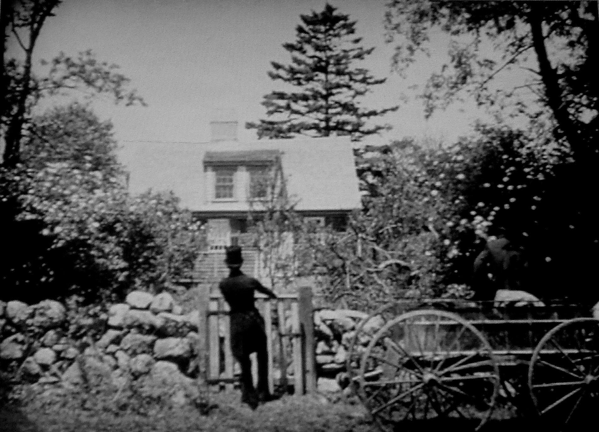 1921 film still of Elmer Clifton's silent movie Down to the Sea in Ships showing the east elevation of Akin House.