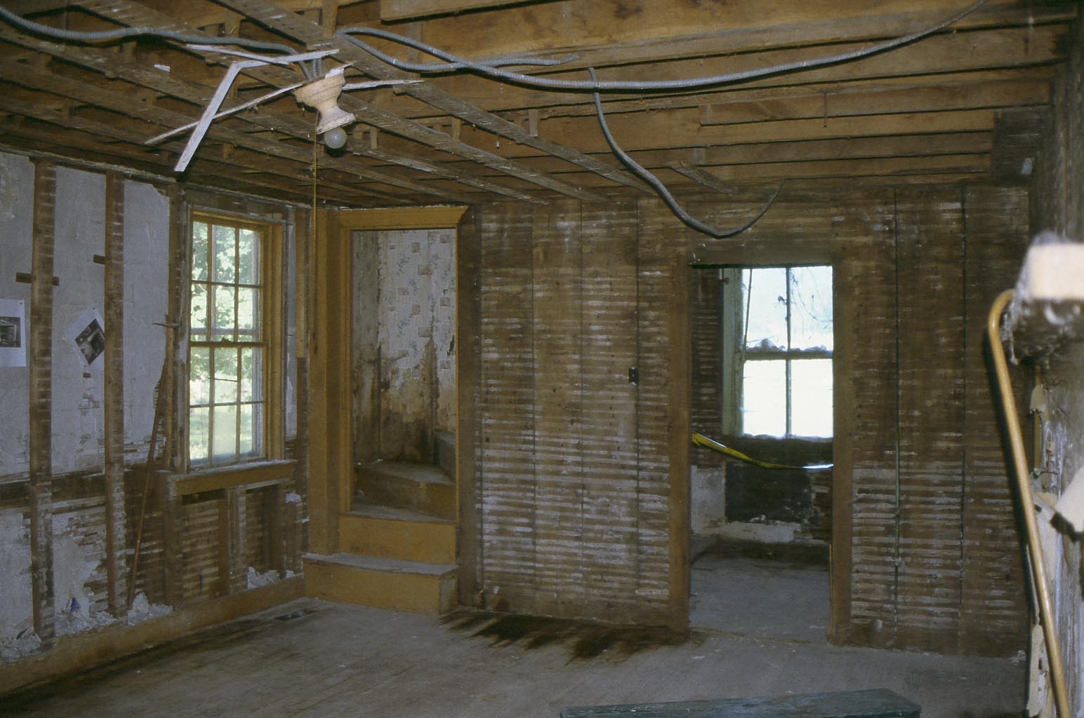 Old kitchen in Cory House showing ceiling, stairs and pantry.