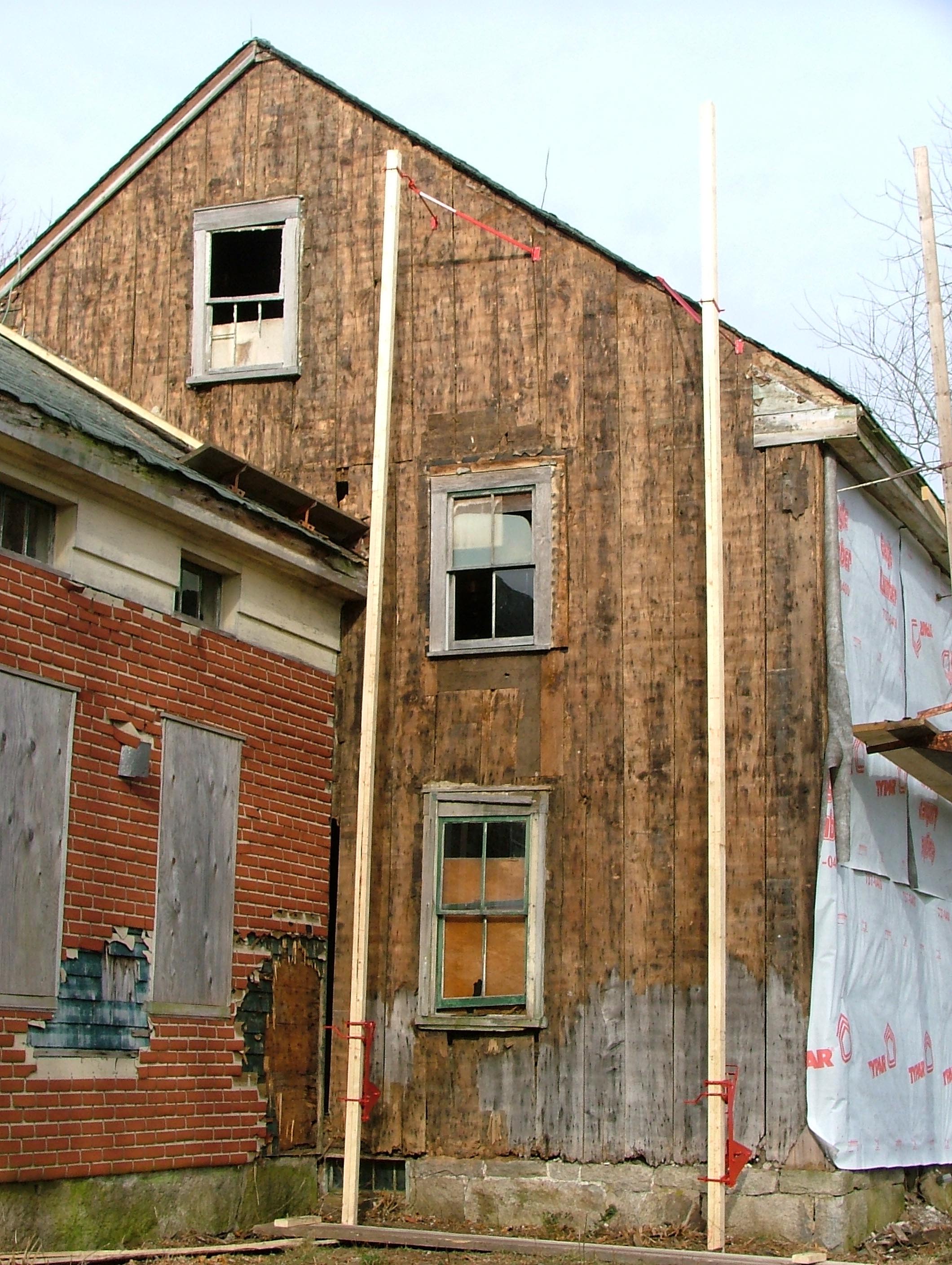 South wall exterior. Stripped down to the clapboard